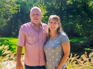 Tranquil Tides owners, JD and Caroline, on their peaceful property.