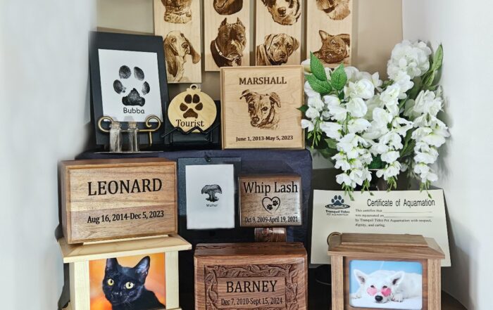 In remembrance of a pet. Pet urn beside a flower bouquet.