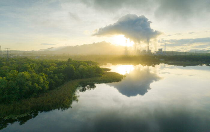 Aerial view coal power plant station in the morning mist, the morning sunrises. coal power plant and environment concept. Coal and steam.