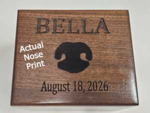 Custom nose print engraved wooden pet urn for individual water cremation honoring a golden retriever.