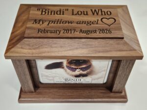 Personalized pet memorial keepsake box with laser-engraved message for individual care.