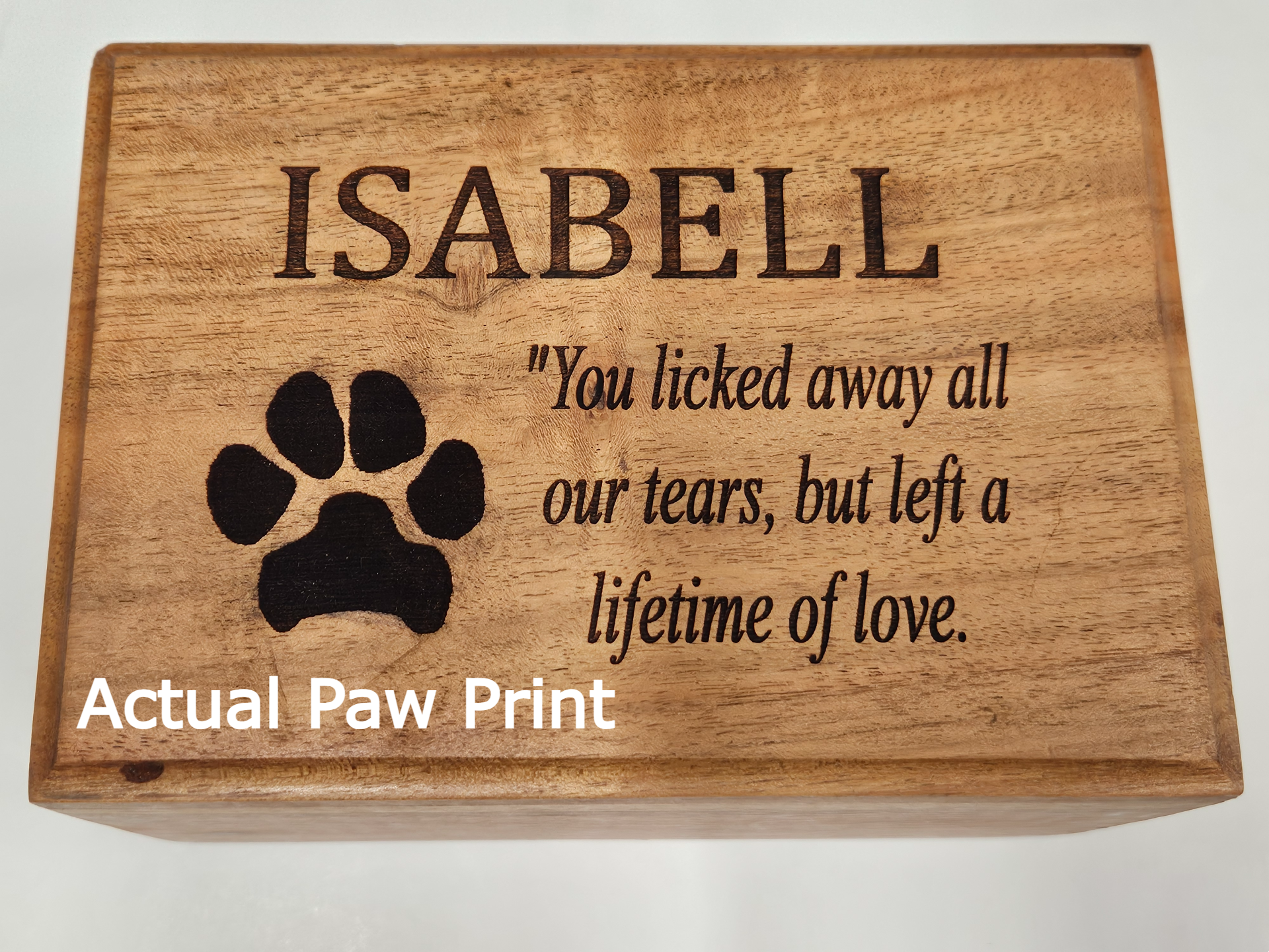 Custom engraved acacia pet memorial box featuring personalized inscription and actual paw print.