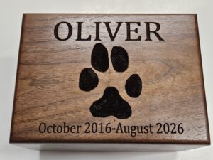 Custom paw print engraved on walnut wood for pet cremation for Springfield and Nixa, MO.